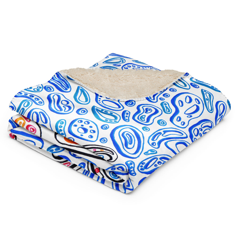 a folded sherpa blanket of an octopus with light blue shapes that look like water.  Optical Illusion artwork.  Nicholas Hayes artist.  optical art.