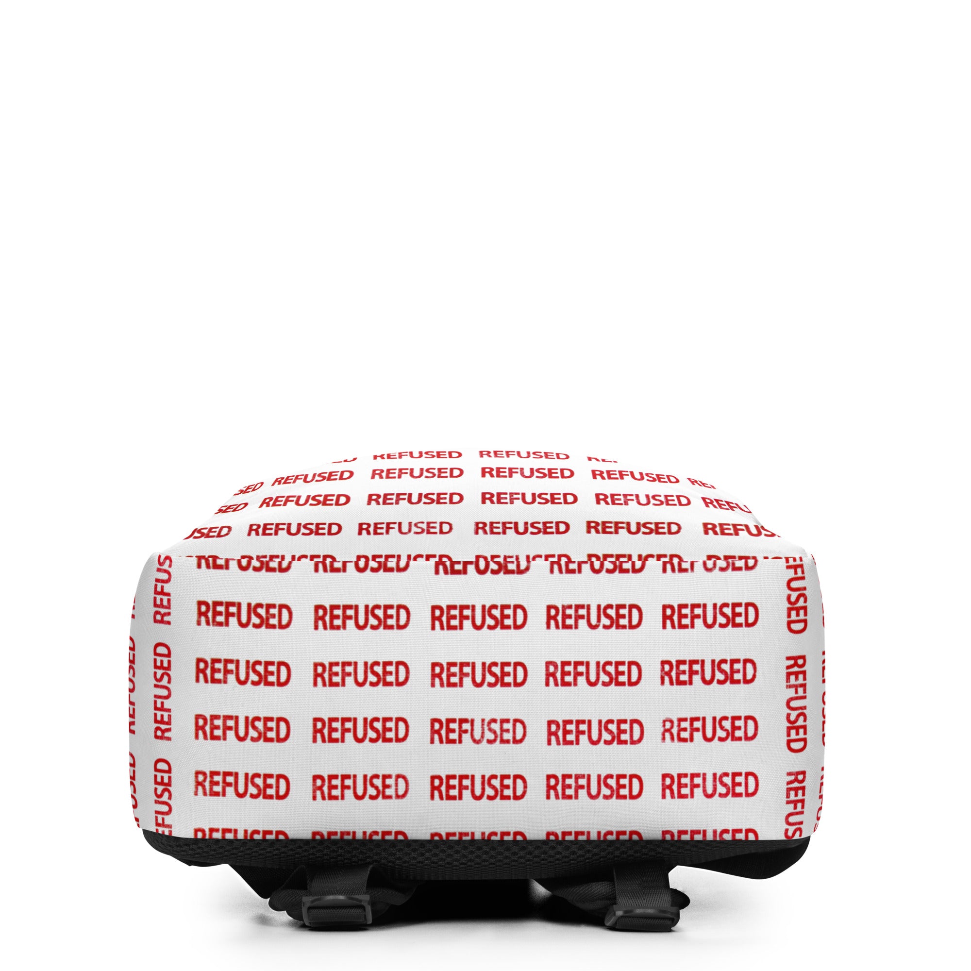 Bottom view of the Refused backpack emphasizing the durable base and full-coverage red “REFUSED” pattern; straps and hardware visible for stability and everyday wear. Artwork and design by Nicholas Hayes.