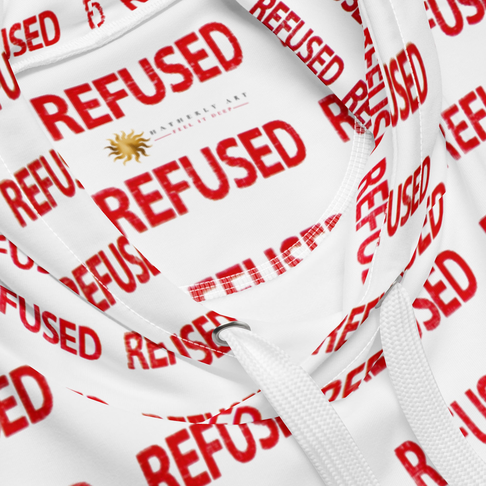 Close-up of neckline and hood interior showing the all-over red “REFUSED” print, clean stitching, metal grommet drawstring detail, and Nicholas Hatherly Art inner label. by Nicholas Hayes a Chicago based optical artist. 