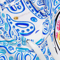 blue and white hoodie design with an octopus. white drawstrings. colorful blue shapes like ocean water design.  Nicholas Hayes art.  optical art artist. 