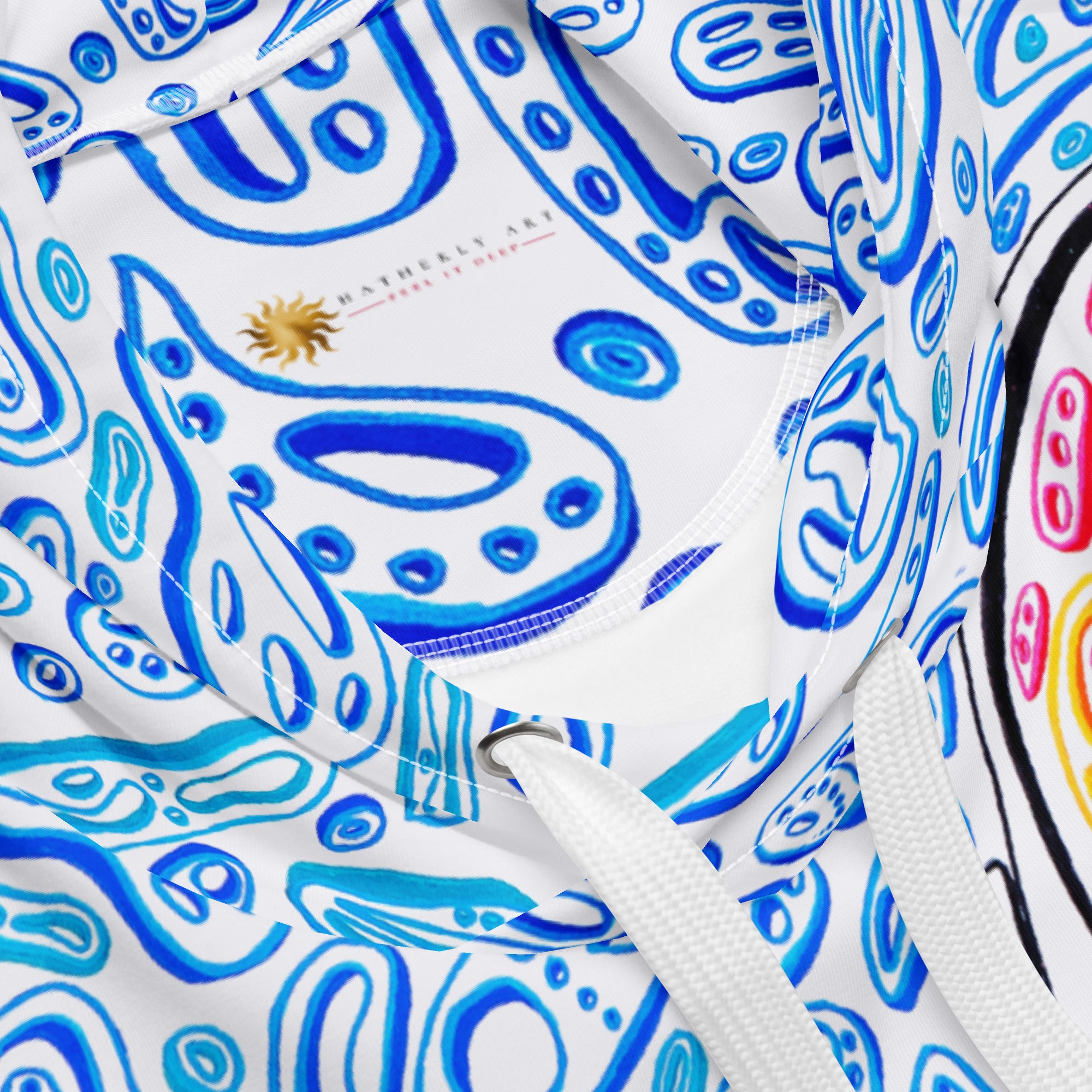 blue and white hoodie design with an octopus. white drawstrings. colorful blue shapes like ocean water design.  Nicholas Hayes art.  optical art artist. 