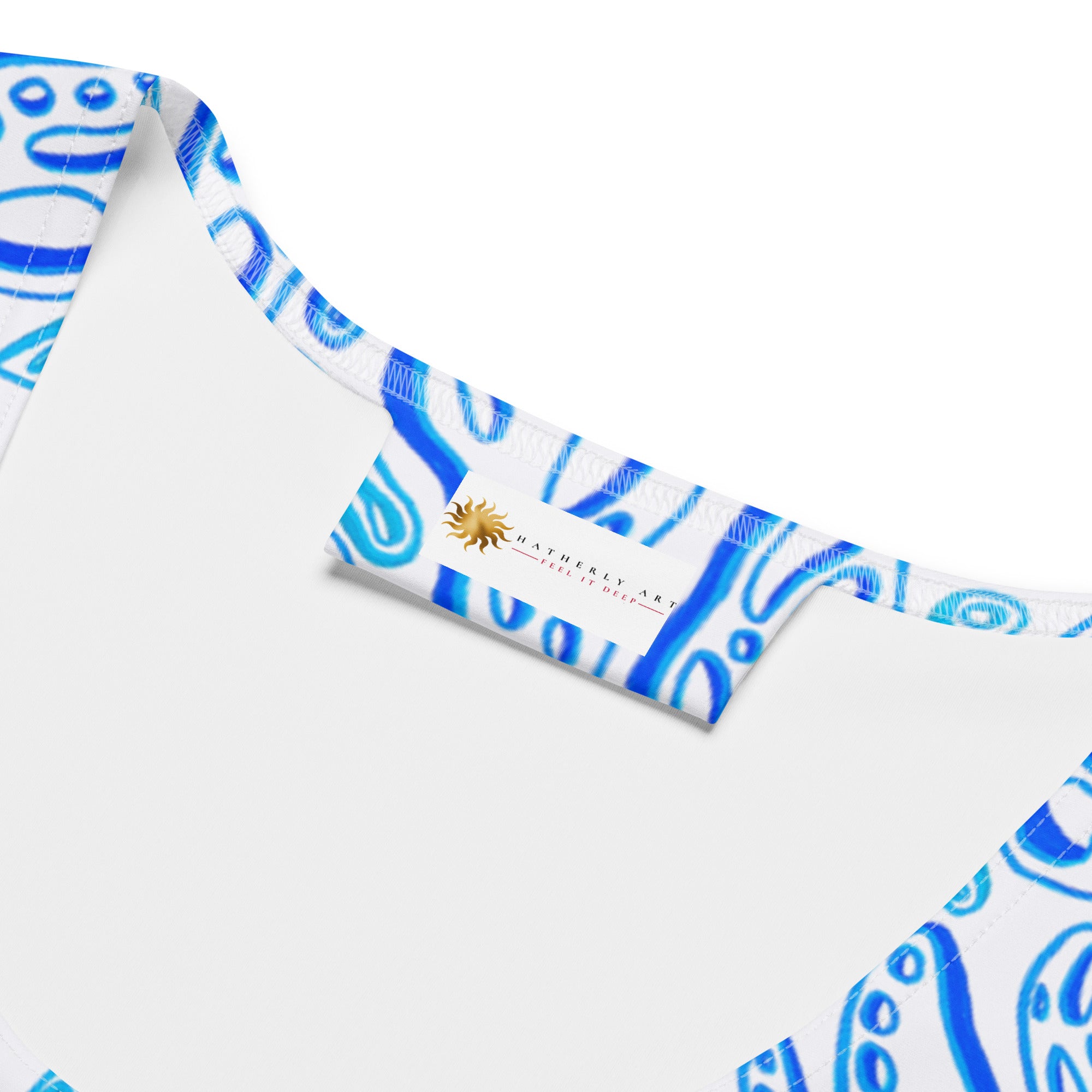 Close-up of neckline and inner tag on The Octopus women’s tank top. Clean overlock stitching, smooth fabric, soft feel against skin; branding label detail emphasizes quality construction for durable activewear. Nicholas Hayes Art graphic tee.