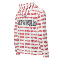 three quarter view of the backside of a white hoodie with red lettering and black lettering spelling the word REFUSED.  the design is by Nicholas Hayes and creates a pattern across the entire jacket.