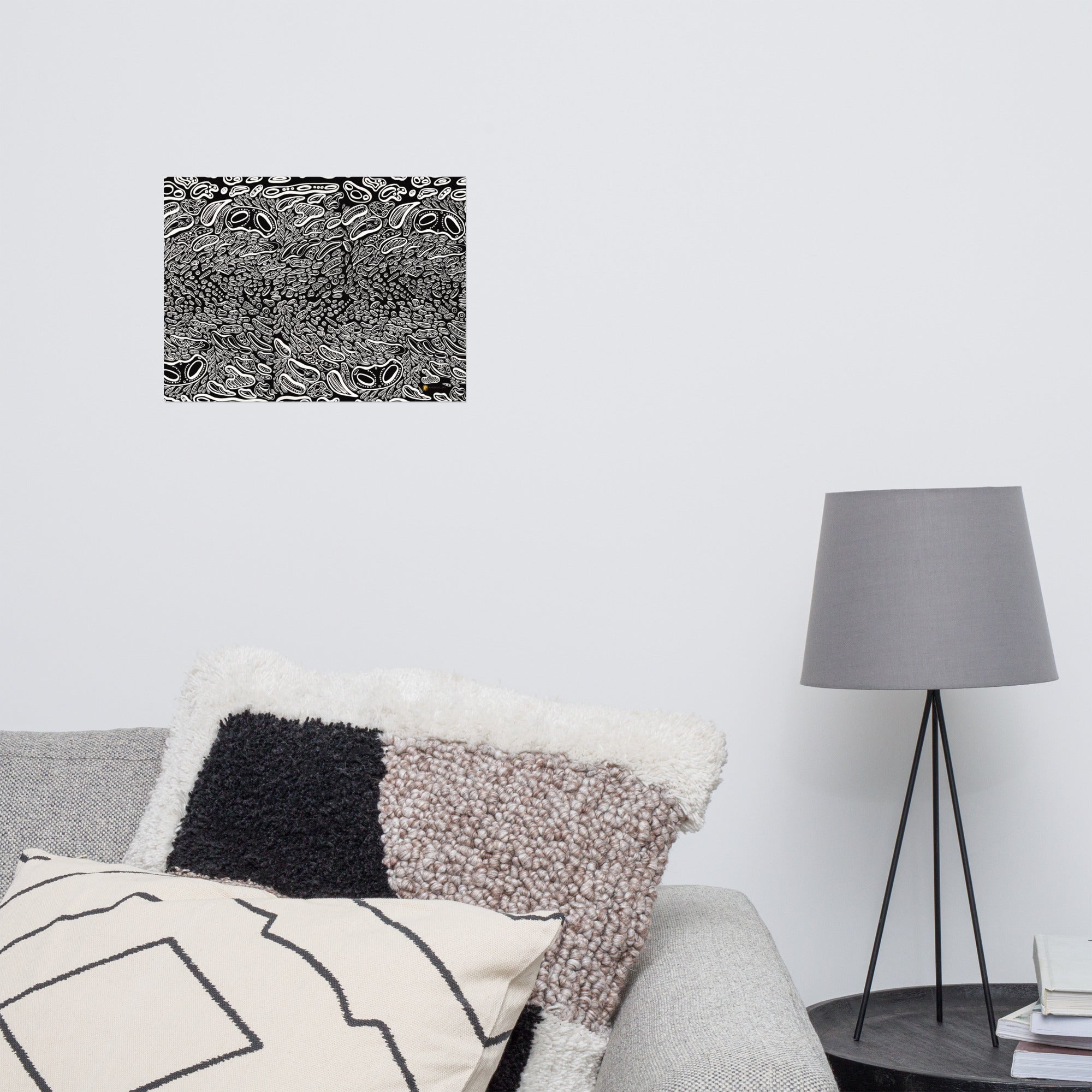 Secondary wall mockup of psychedelic art by emerging Chicago-based artist Nicholas Hayes. 12×16 fine art print above a couch.  Minimalist trippy black and white abstract design centered on a clean wall, highlighting its striking graphic impact for modern interiors.
